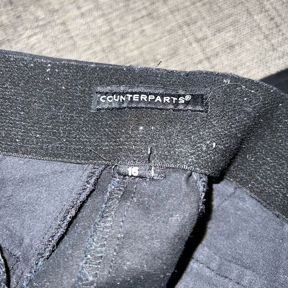 Woman’s black capris.